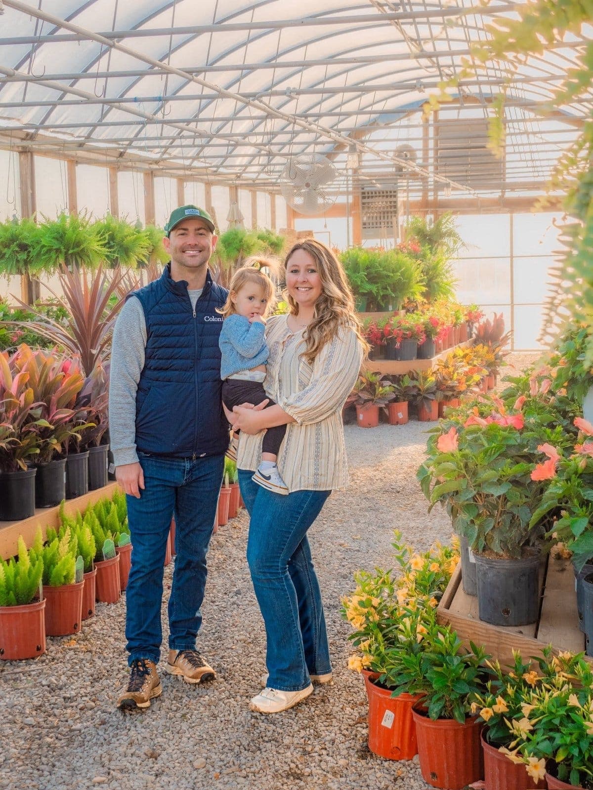 Andrew and Jesse Diekhoff with their daughter in the Colonial Classics greenhouse