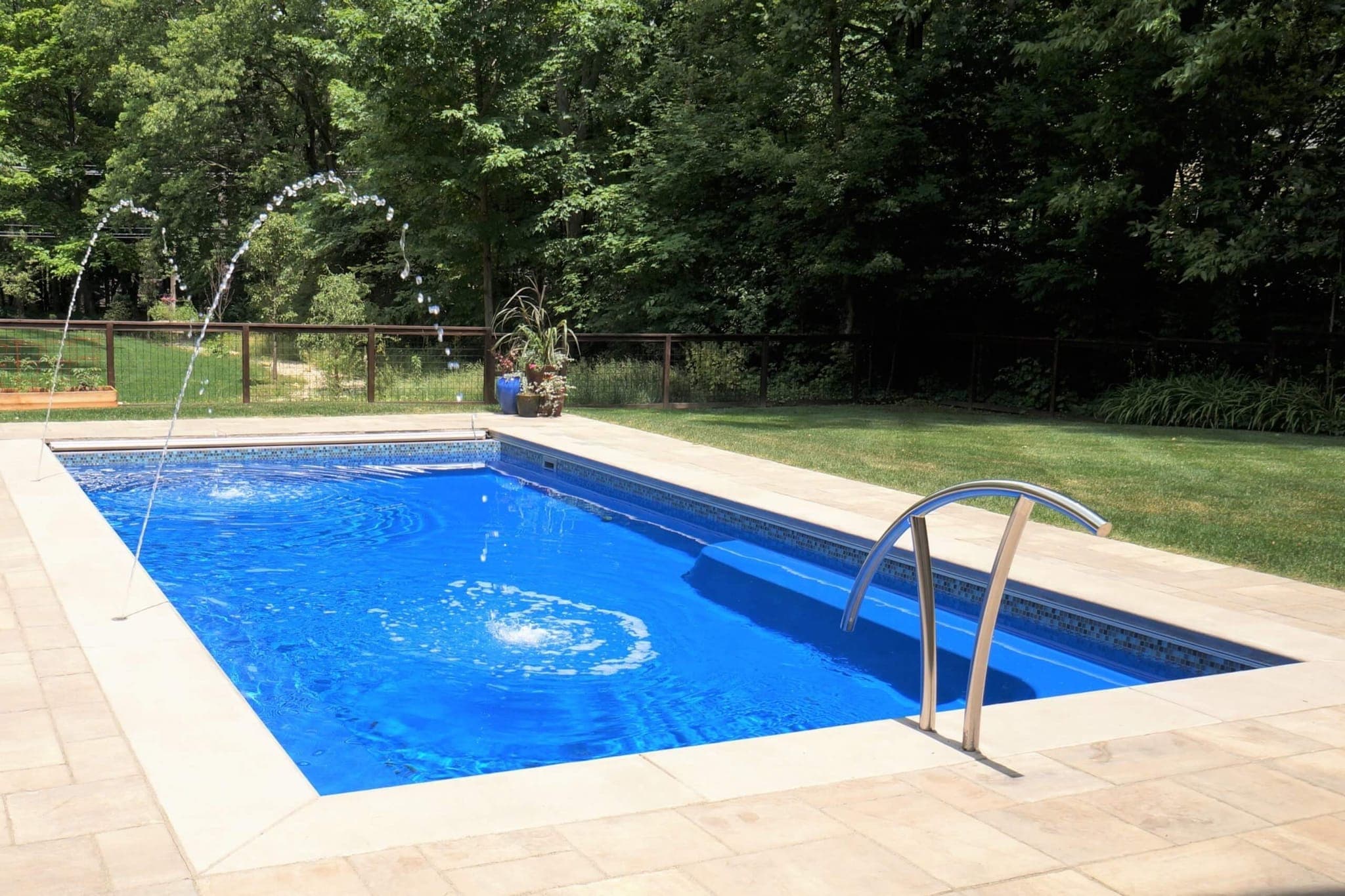 Lil Bob flat-bottom sport pool installed with patio