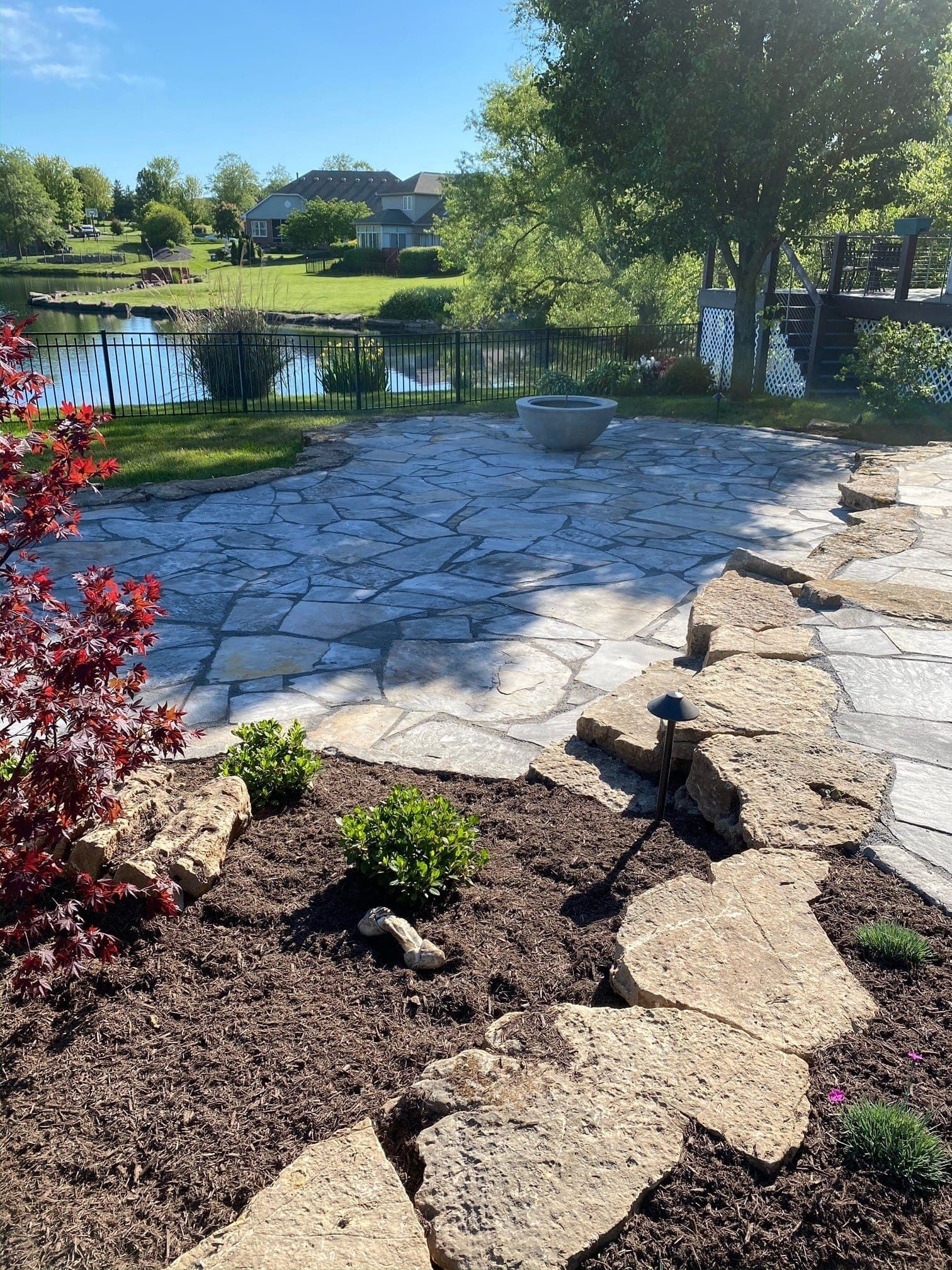 Custom flagstone patio with outdoor seating area