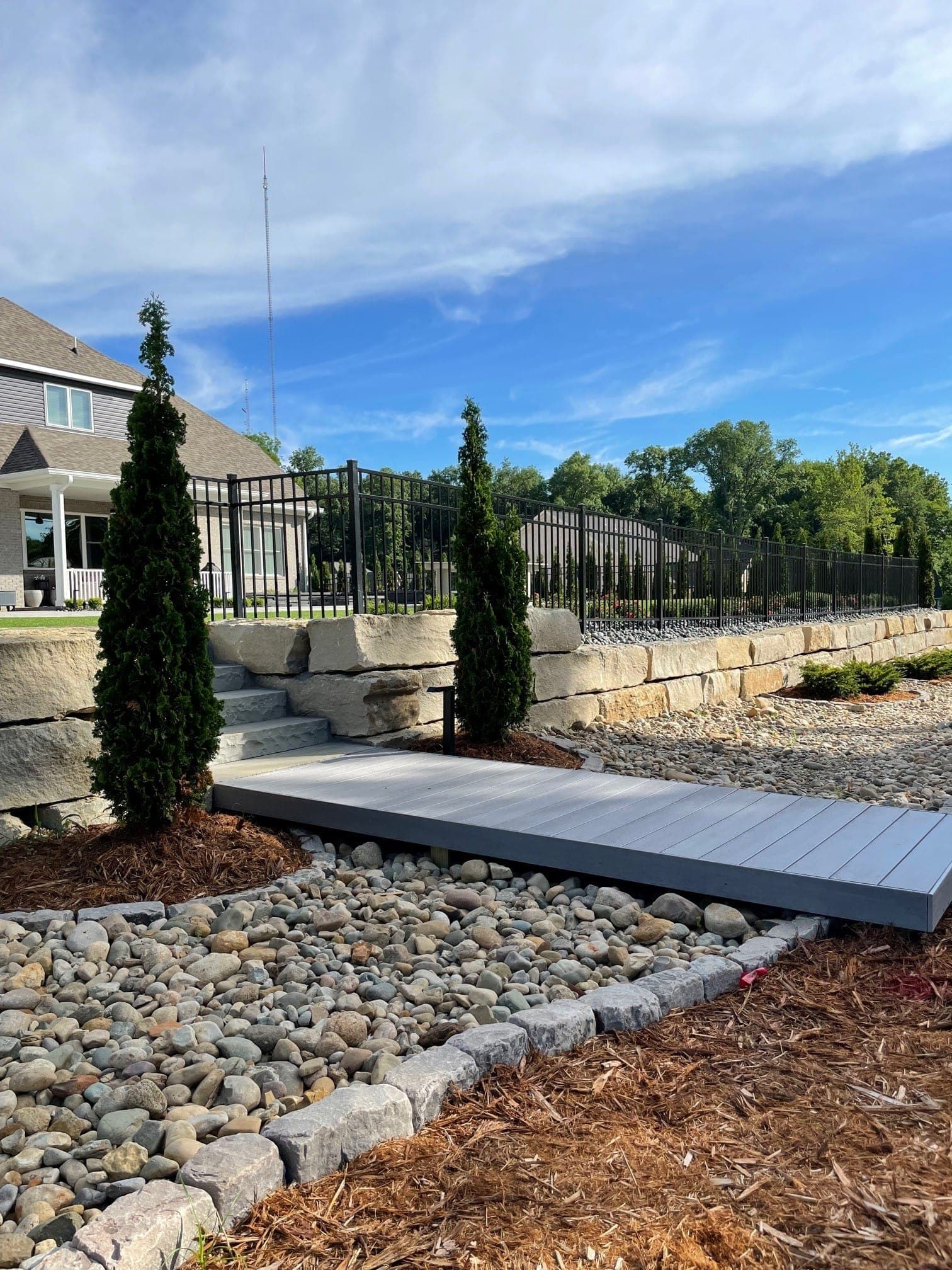 Custom stone walkway with landscape plantings